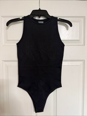 OQQ Woman’s Black Ribbed One-Piece Bodysuit